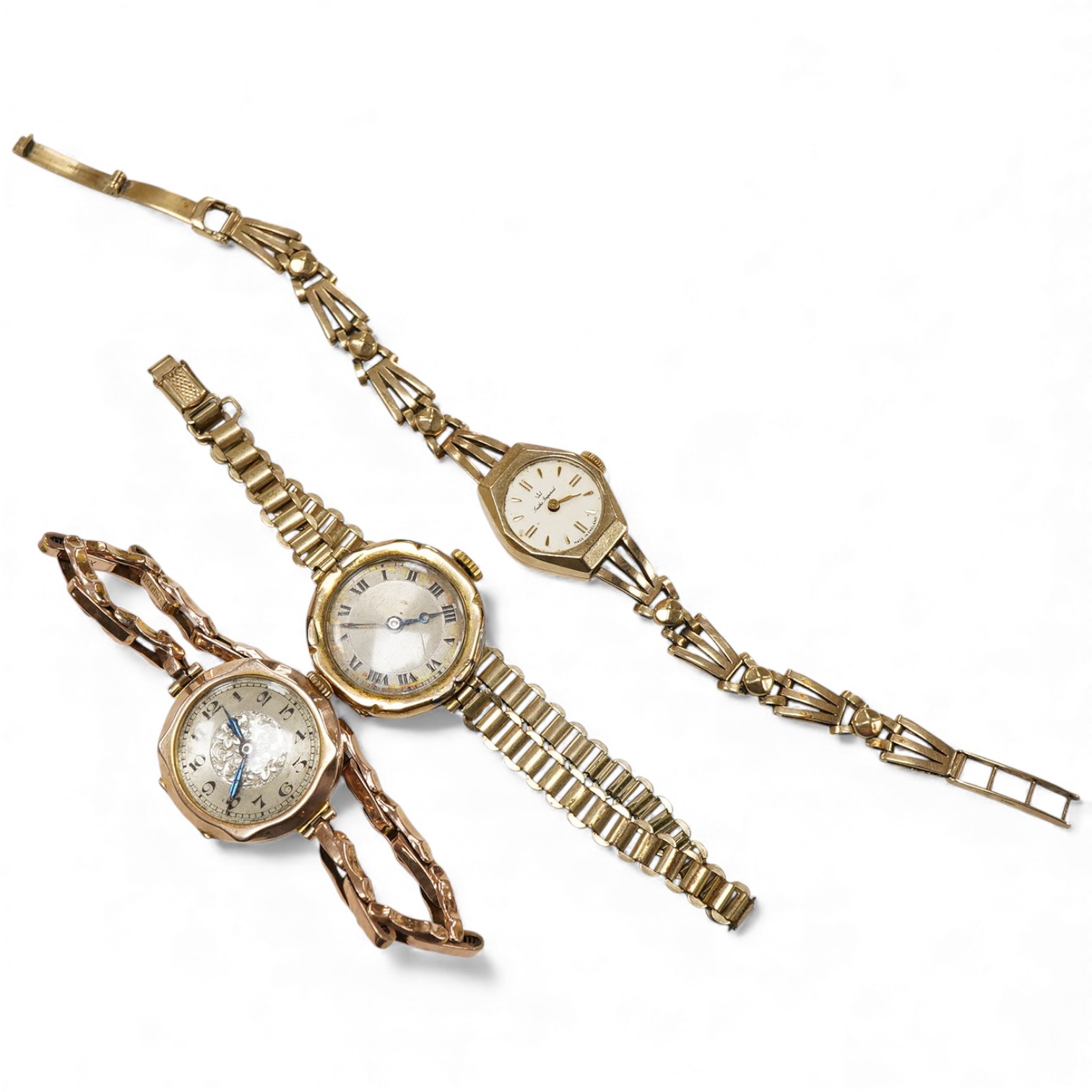 Two 9ct lady’s manual wind wrist watches on 9ct bracelets, gross weight 34 grams, including Smiths Imperial and another 9ct watch head on a rolled gold strap bracelet.